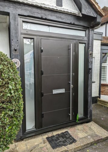 A massive Black Cromford Solid from Solid Core Door's with a stainless steel bar handle alongside the super secure Ultion Cylinder fitted in Edgware