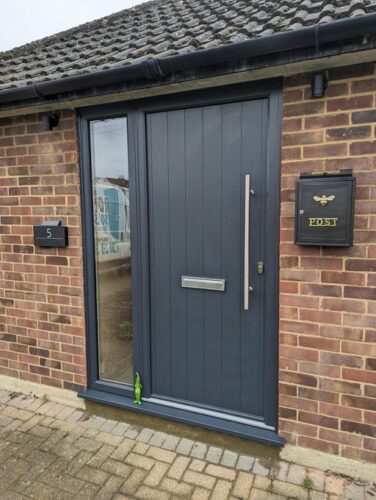 An amazing Anthracite Grey Ancona Solid Solidor, with a lovely Stainless Steel Bar Handles alongside the super secure Ultion Cylinder fitted in Bedford