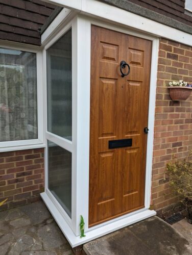 A striking Golden Oak Tenby Solid Rockdoor with a new sidelight, welded cill and bay pole fitted in Hemel Hempstead