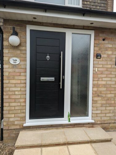 A stunning Black Palermo Solid from Solidor, with a Stainless Steel Bar Handle and the sidelight glass is digital. Alongside the super secure Ultion fitted in St Albans