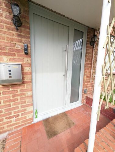A perfect painswick Ancona Solid from Solidor, with a Stainless Steel Bar Handle alongside super secure Ultion fitted in Abbots Langley