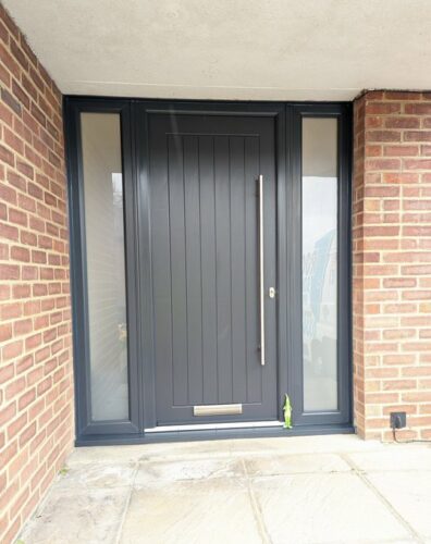 An imposing Anthracite Grey Newstead Solid from Solid Core Doors with Stainless Steel Bar Handles alongside the super secure Ultion Cylinder fitted in St Albans